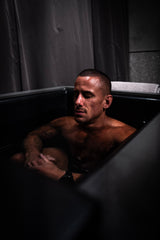 A man in an ice bath for wellness event supplement wholesalers 