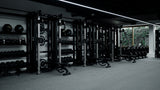 Weight racks in a gym showing gym protein wholesale
